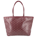 Maroon patterned tote bag with double leather handles and stitched trim