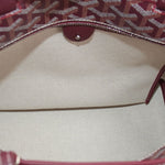 Maroon tote interior with leather snap closure and light fabric lining