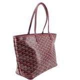 Maroon patterned tote bag with leather handles and structured rectangular shape