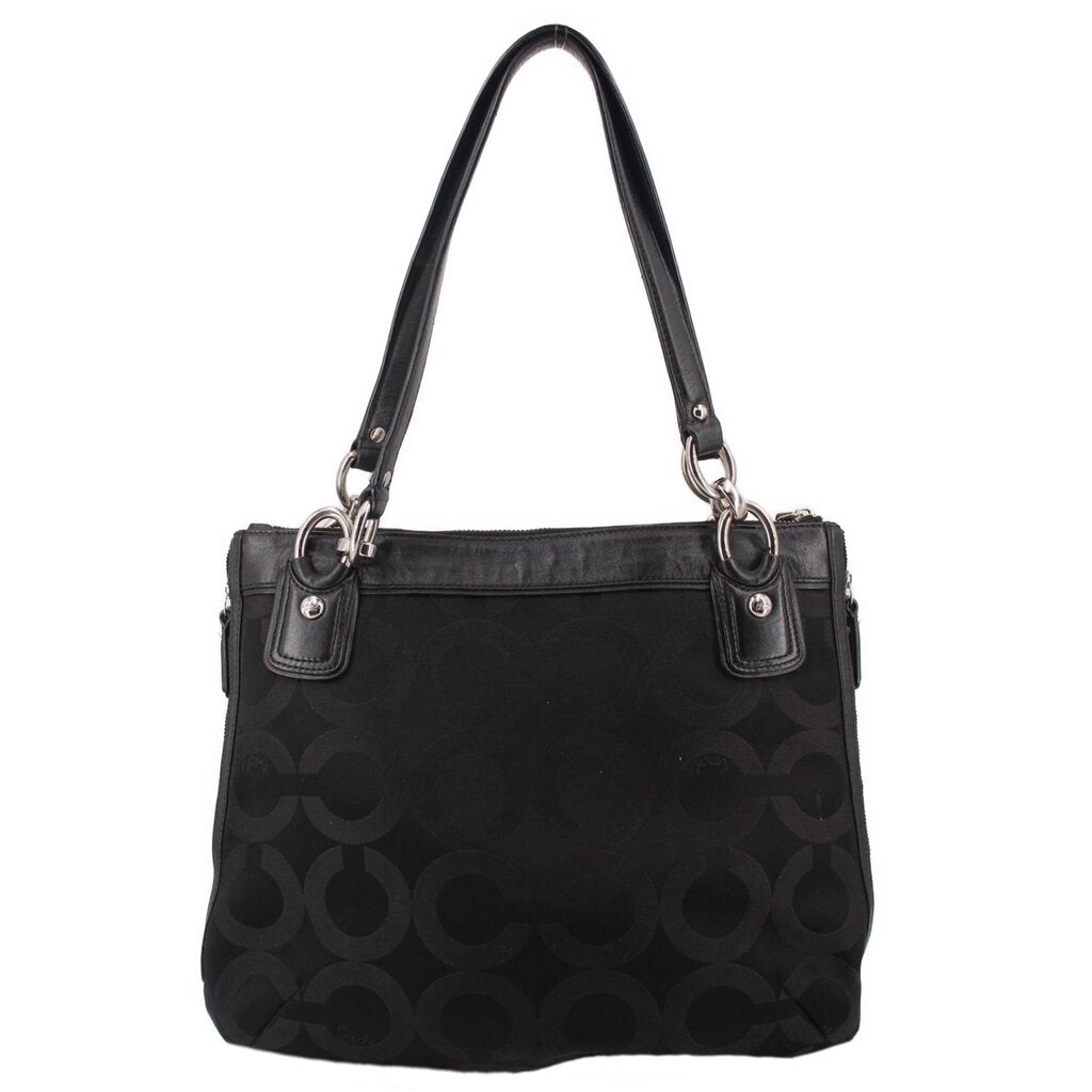 Black shoulder bag with monogram pattern and front snap lock detail