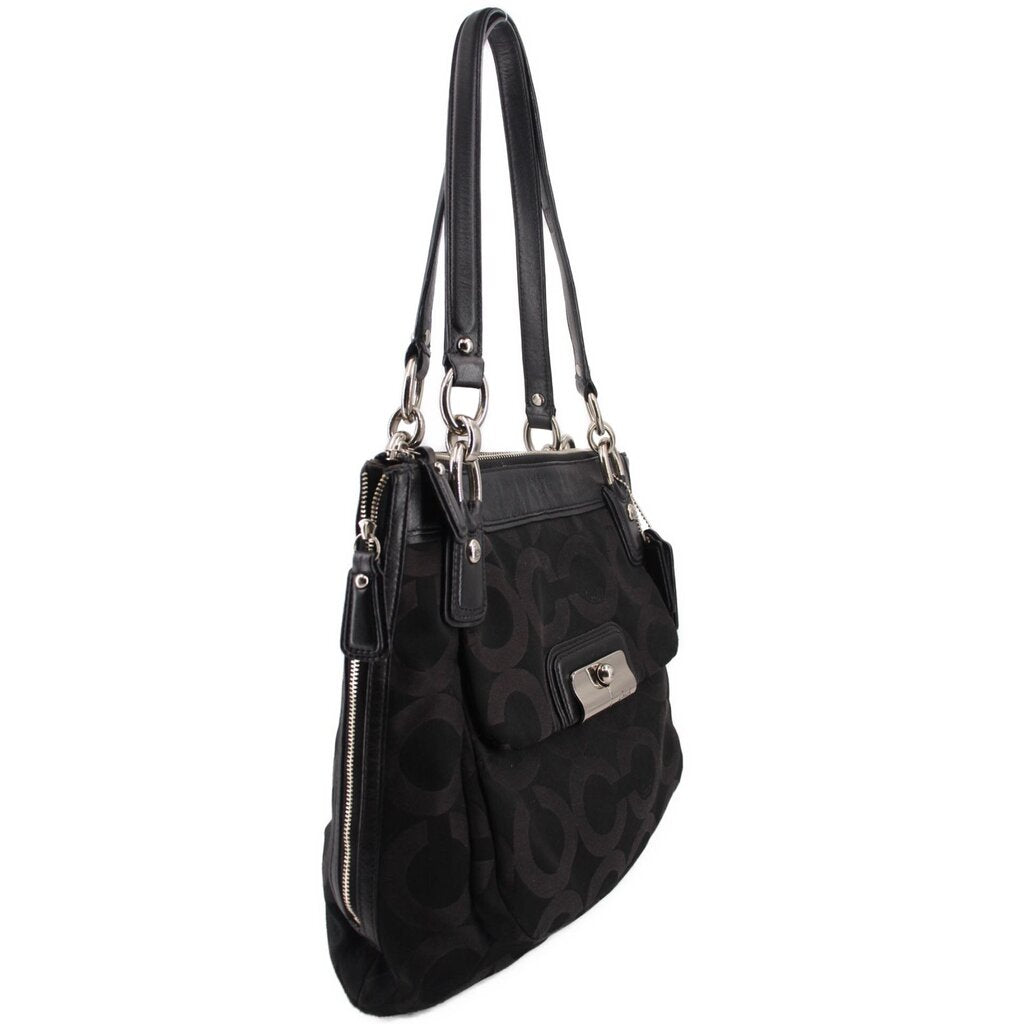 Black shoulder bag with monogram pattern, side zip pocket, and long carry handles
