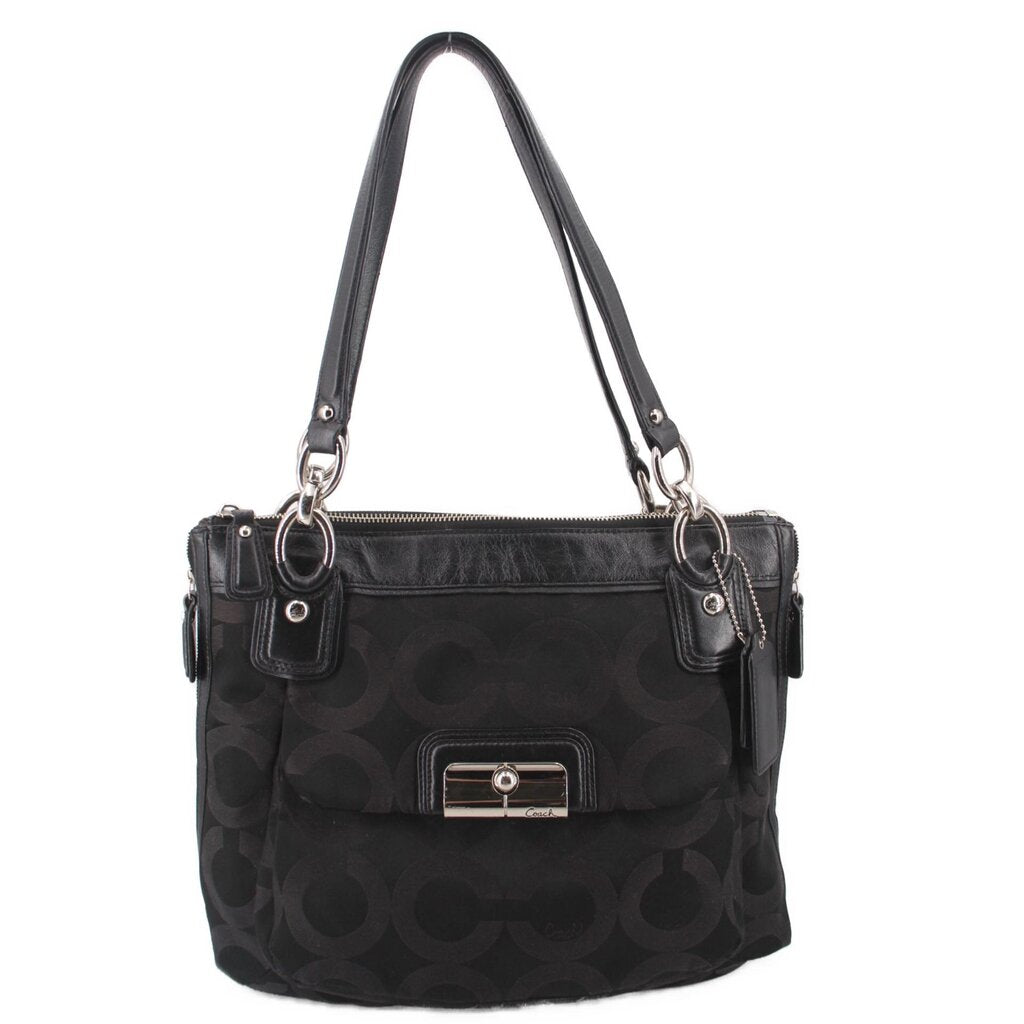 Black shoulder bag with monogram pattern, top zip, and two front pockets
