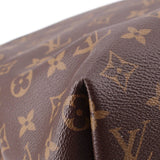 Brown Monogram leather corner close-up with textured grain and embossed pattern