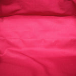 Red fabric interior lining of a Louis Vuitton Monogram shoulder bag