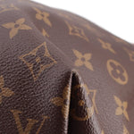 Brown Monogram leather edge close-up with stitched border and embossed marks