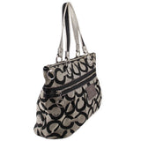 Black and beige op-art shoulder bag, side view with zip pocket and metal hardware