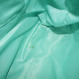 Teal interior lining panel with visible stitching and fabric texture