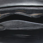 Black crossbody bag interior with stitched lining and zipper opening