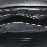 Black crossbody bag interior with stitched lining and zipper opening
