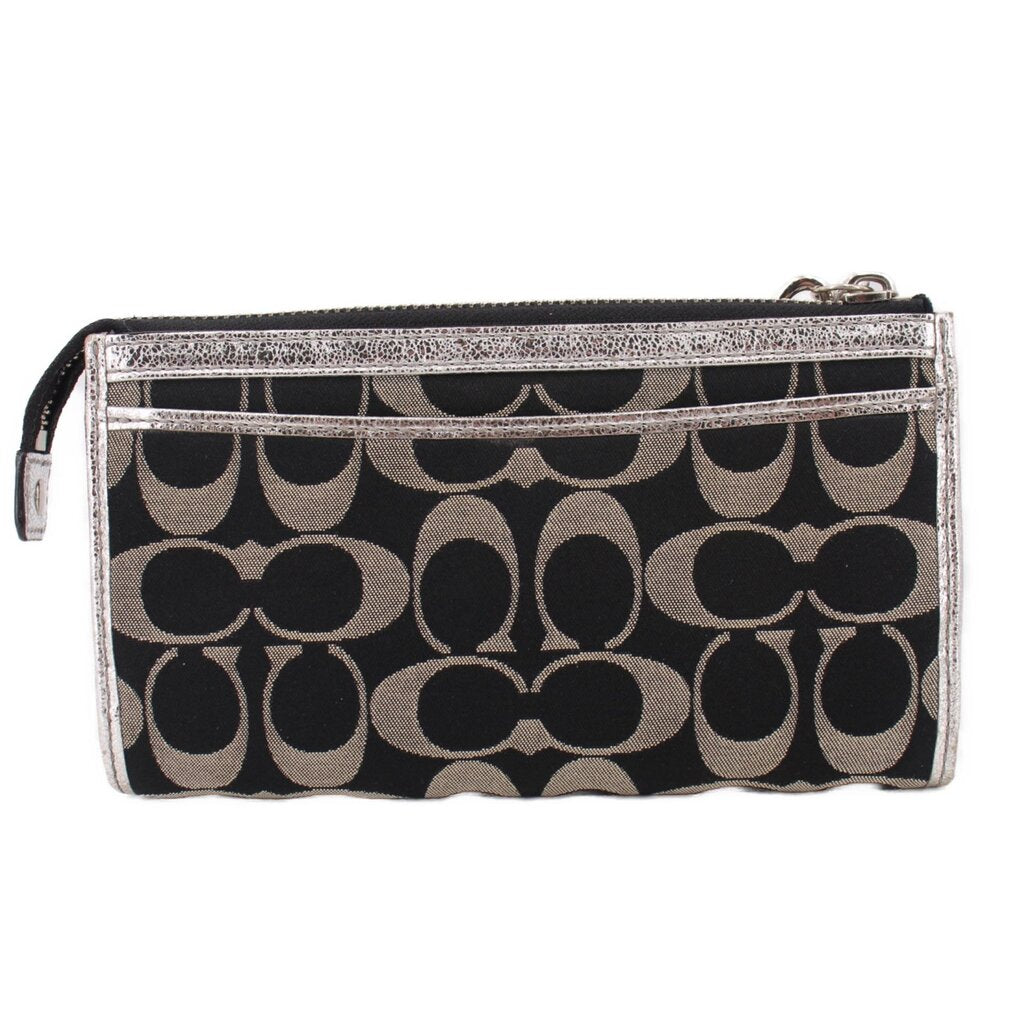 COACH signature black-and-silver wristlet pouch with zip pocket and wrist strap