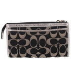 COACH signature black-and-silver wristlet pouch with zip pocket and wrist strap