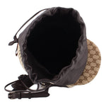 Brown logo bucket bag interior view with black satin drawstring and adjustable leather strap