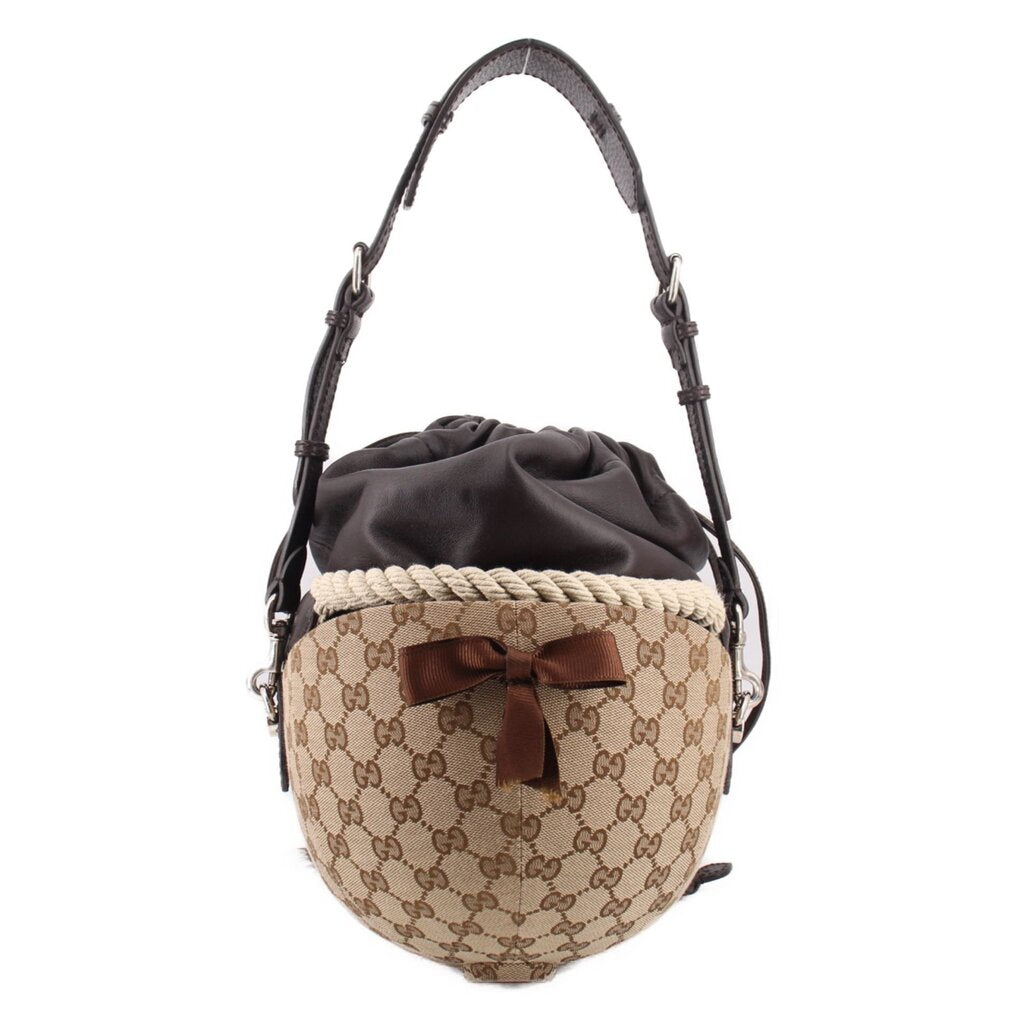 Brown logo bucket shoulder bag with black pouch top, braided rope belt, leather bow