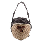 Brown logo bucket shoulder bag with black pouch top, braided rope belt, leather bow
