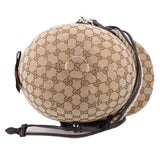 Brown logo crossbody bucket bag with GG pattern, front emblem patch, black strap