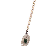 CHANEL gold necklace with crystal heart pendant and green center
