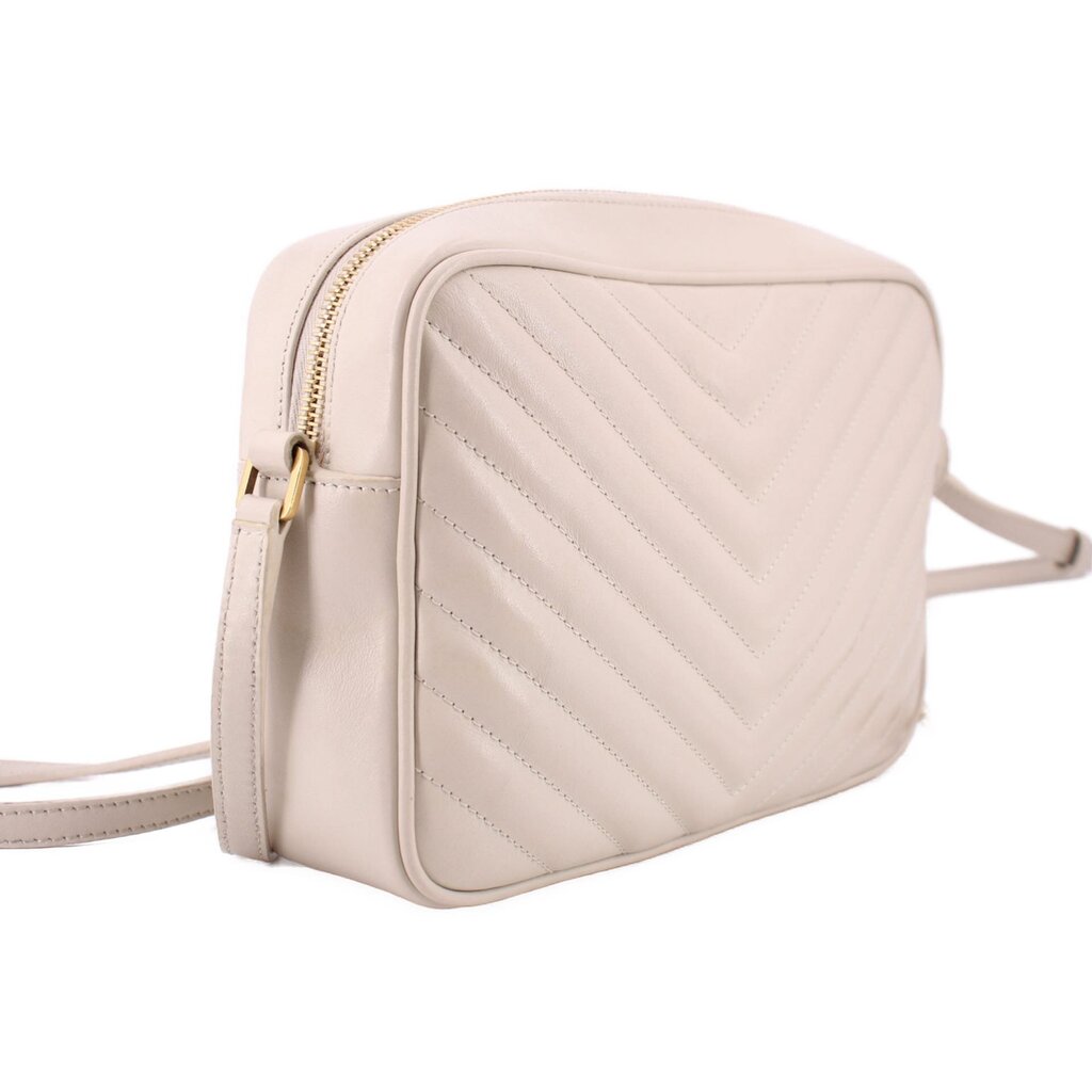 Bone leather crossbody bag side view with quilted panels and adjustable strap
