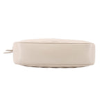 Bone leather crossbody bag bottom view with rounded edges and seam detailing