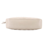 Bone leather crossbody bag bottom view with rounded edges and seam detailing