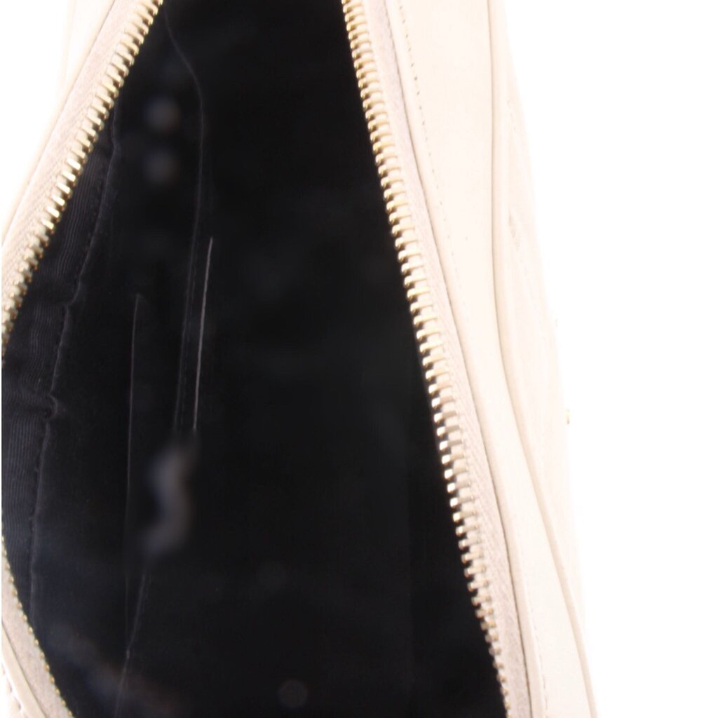Crossbody bag interior close-up with dark lining and gold-tone zipper