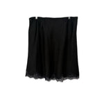 Black satin skirt, lace-trim hem and gathered drape at waist