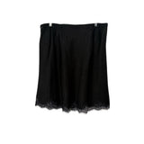 Black satin skirt, lace-trim hem and gathered drape at waist