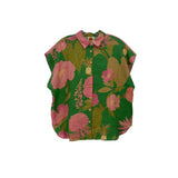 Green floral print button-up top with short sleeves and pink collar trim