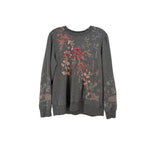 Gray embroidered sweatshirt with floral and butterfly motifs on front