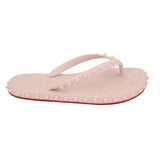 Blush flip-flop sandals with arch toe strap and red-trim studded outsole
