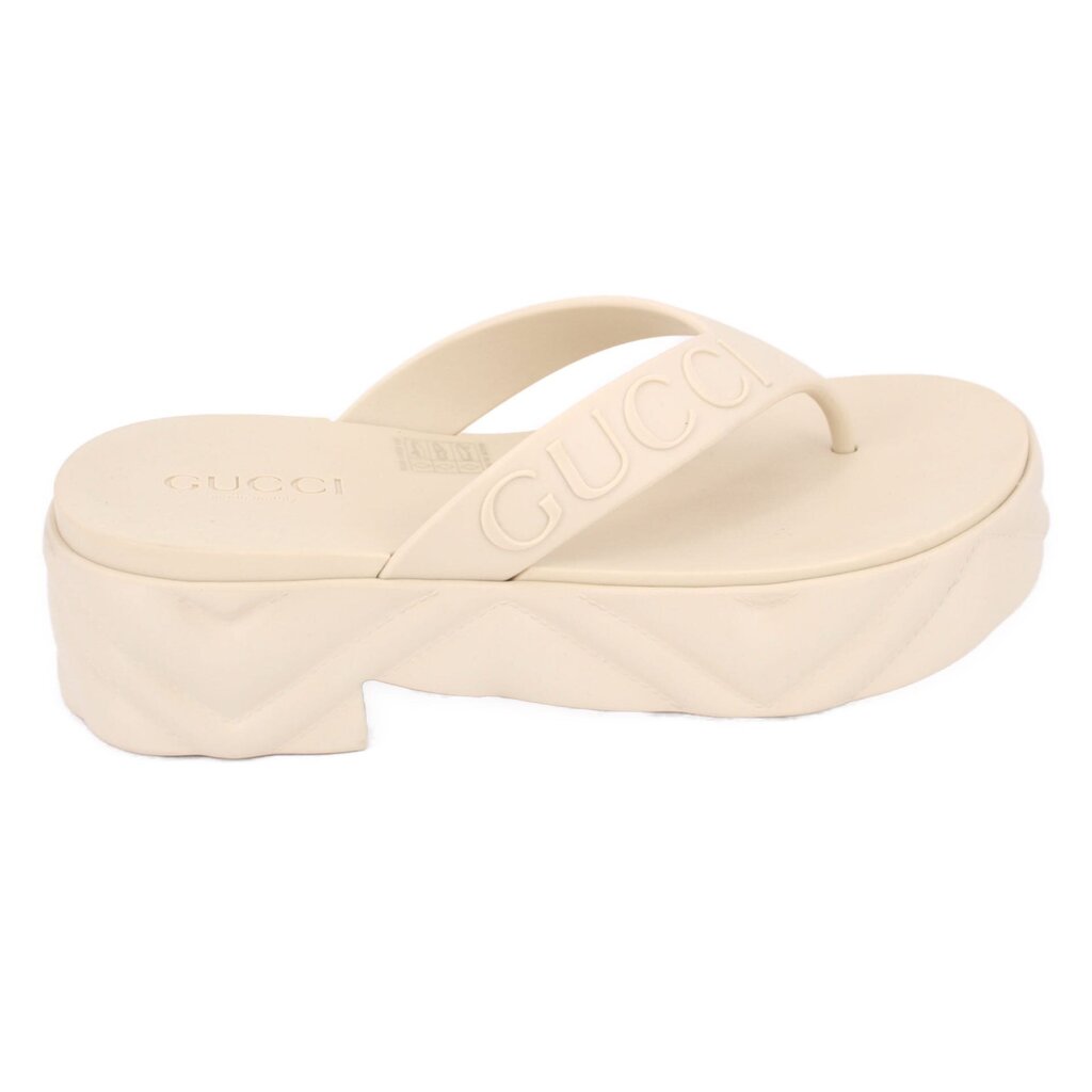 Cream rubber GUCCI flip-flop sandals with wide platform and embossed logo strap