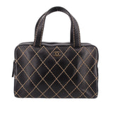 Black structured handbag with rounded top handles, gold diamond stitching, and CHANEL emblem