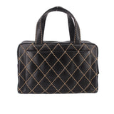 Black quilted handbag with gold diamond pattern and rounded top handles, front view