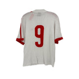 White jersey top back with large red number 9 and red striped sleeve trim