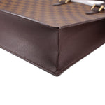 Louis Vuitton Damier Ebene tote bag corner close-up with brown leather edging