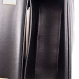 Black crossbody bag interior lining and side seam close-up