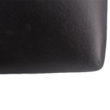 Black crossbody bag texture close-up on the side panel