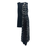 Black sleeveless pleated dress with textured front panel and asymmetrical hem