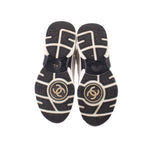 CHANEL cloth sneakers, outsole view with dark tread and circular logo accents