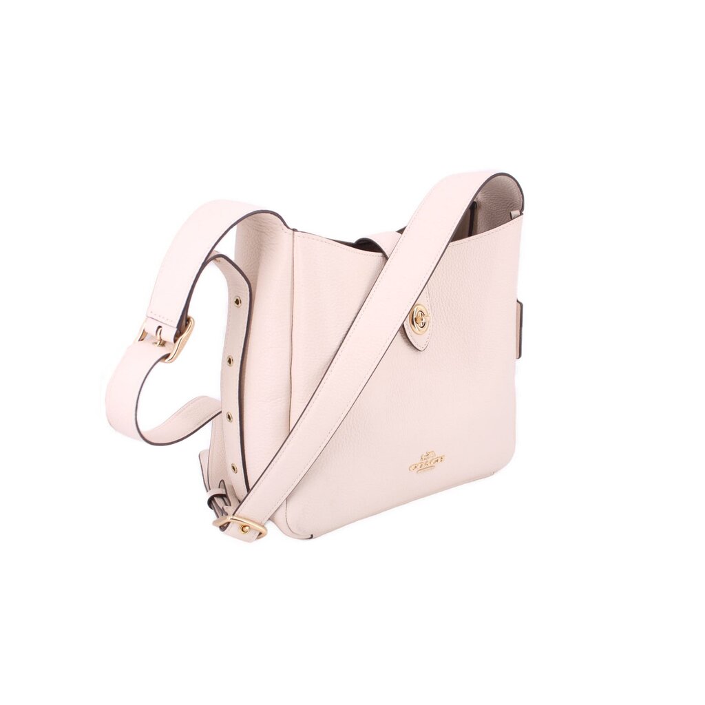 Cream leather crossbody bag with D-ring strap and gold-tone hardware, side profile view.