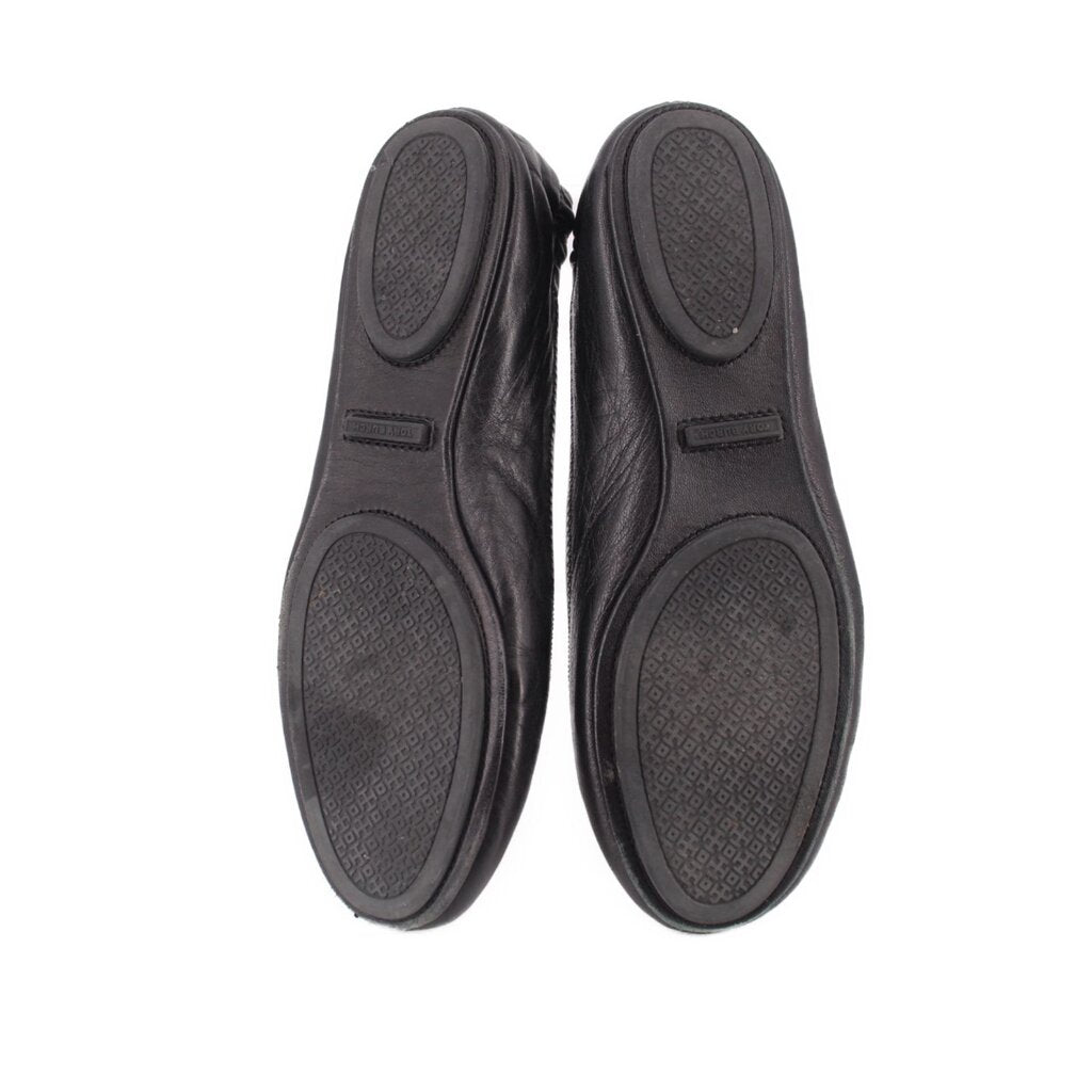 Black ballet flat outsoles with textured pattern, pair view