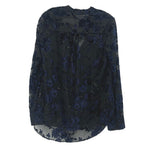 Velvet print blouse with scattered blue floral motifs, round neck, long sleeves