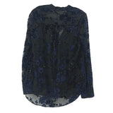 Velvet print blouse with scattered blue floral motifs, round neck, long sleeves