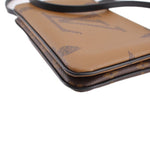 Close-up of brown monogram crossbody pochette corner and trim edge