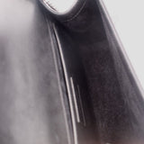 Black interior pocket view of SAINT LAURENT crossbody bag lining detail