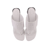 White slide sandals with embossed logo detail and open-toe straps