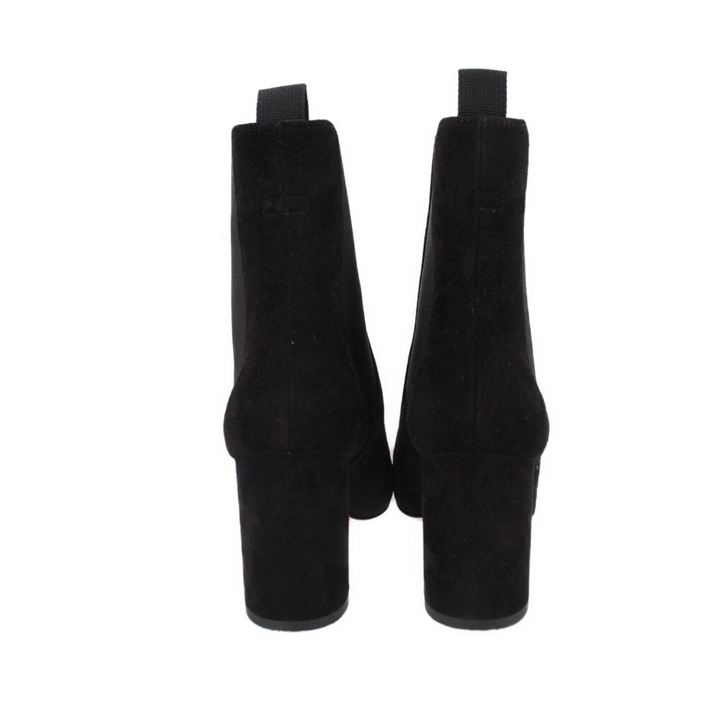 Black suede ankle booties with wide block heel and back pull tabs
