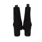 Black suede ankle booties with wide block heel and back pull tabs
