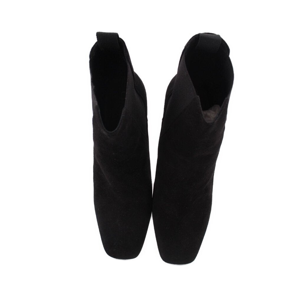 Black suede ankle booties with stacked block heels, back view