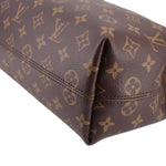 Louis Vuitton monogram corner detail, brown canvas with tan stitching and reinforced edge