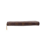 Zippy wallet with dark brown monogram canvas and gold-tone zipper along the side